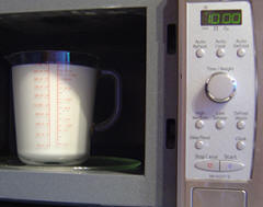 Heat milk in microwave